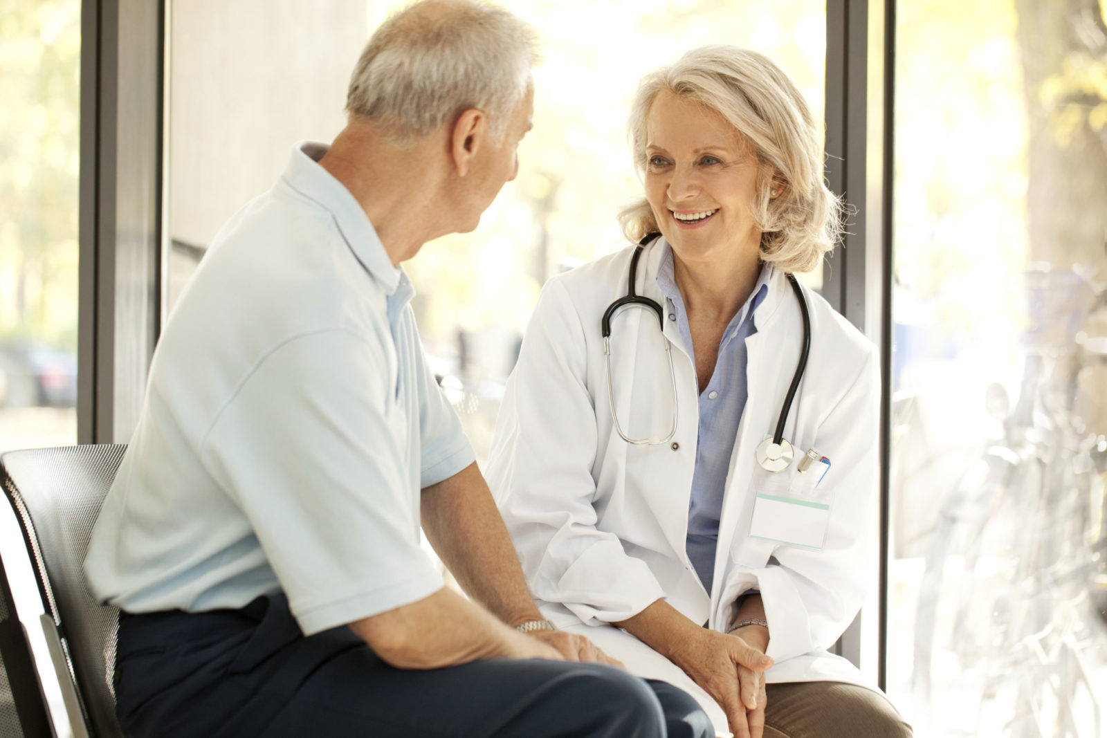 Doctor comforting a patient in her clinic