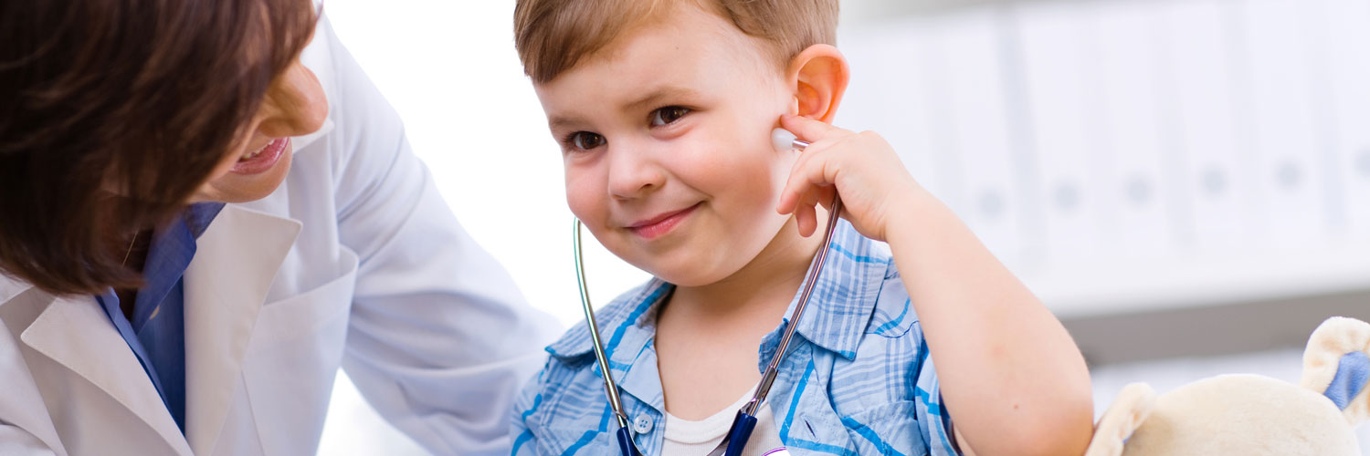 young both listening to his heartbeat through a stethoscope